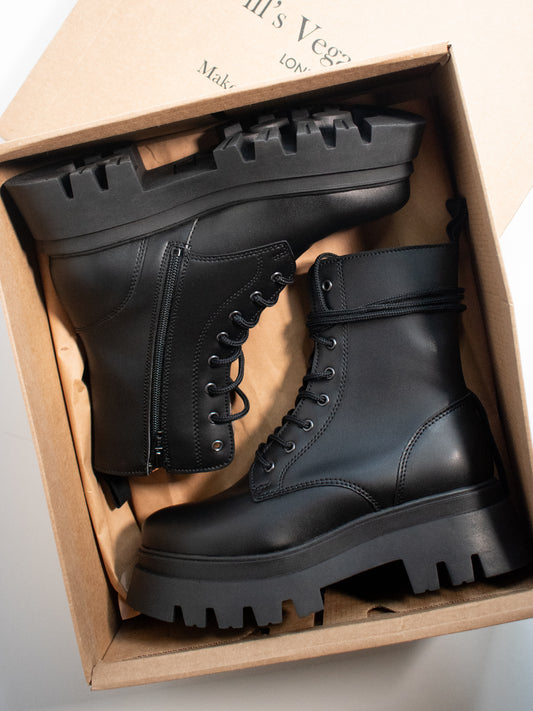 Track Sole 8-Eye Lace Up Boots in Black